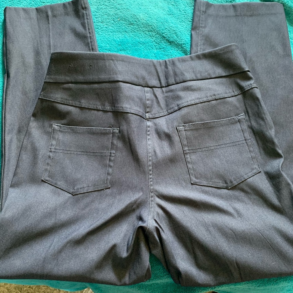 Kim Rogers pull on Navy slacks